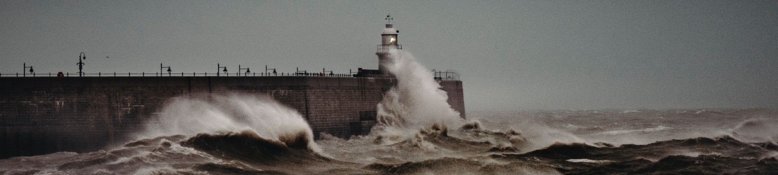 Waves hitting a lighthouse